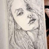 Woman drawing portrait – Sketchbook drawing